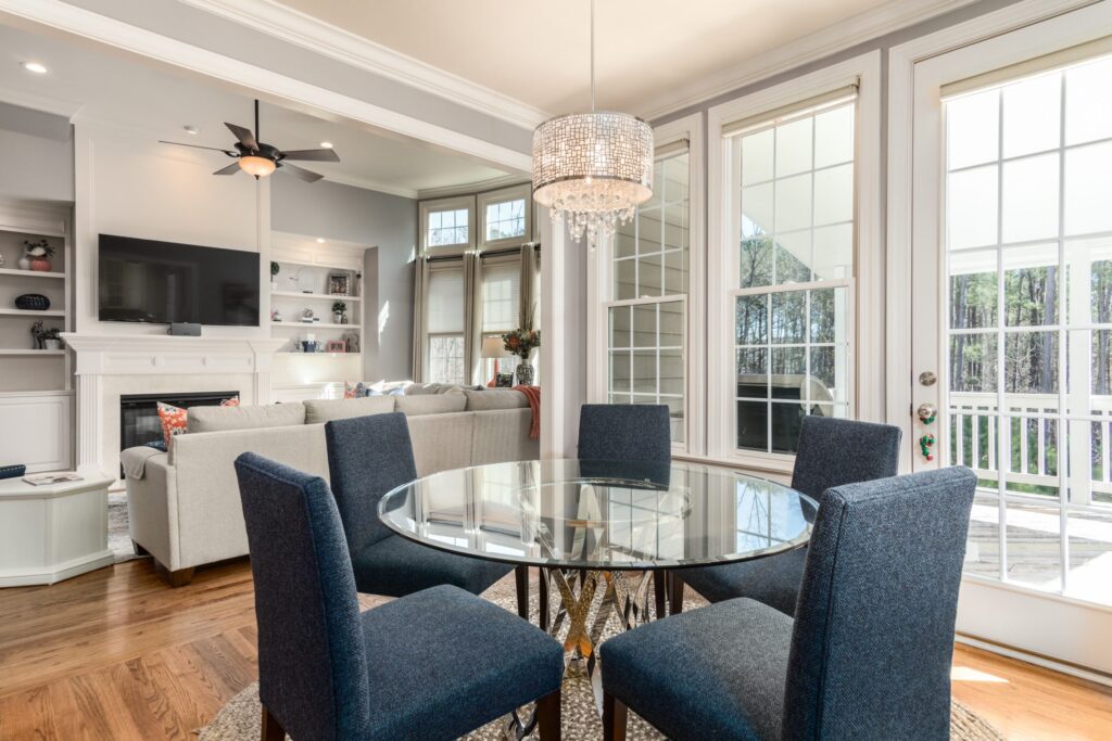 round dining room table with chandelier
