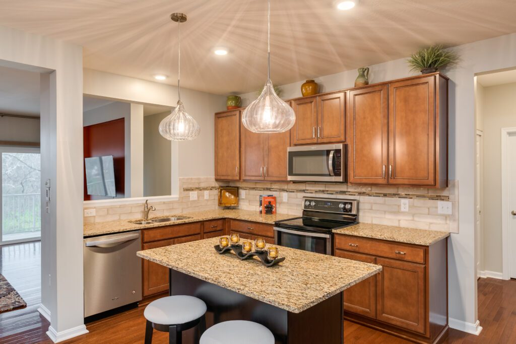 Kitchen with contemporary, teardrop pendant light and granite counter tops